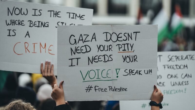 Thematic lead image: protest, shroud, names of children — Ecumenical Activism Challenges Consensus on Gaza Conflict Terminology | National Times