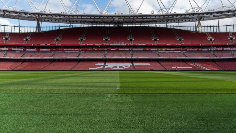 Thematic lead image: Football stadium at night — Arsenal's Unbeaten Start: A Predictive Test of Premier League Dynamics | National Times