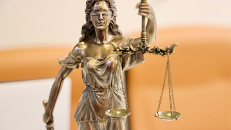 Thematic lead image: Justice scales, public opinion — Jay-Z Rape Accusation Retraction: Implications for Public Allegations | National Times