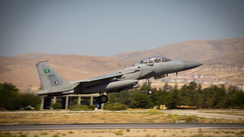 Thematic lead image: F-15 fighter jet in desert landscape — F-15 Sale to Saudi Arabia: Red Sea Stability to 2030 | National Times