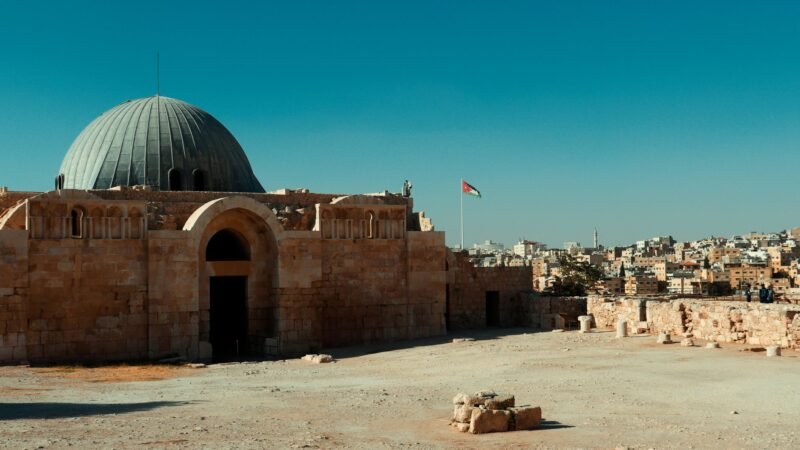 Thematic lead image: Jordanian flag, West Bank landscape — Jordan's Calculus: West Bank Escalation Forces Amman's Hand | National Times
