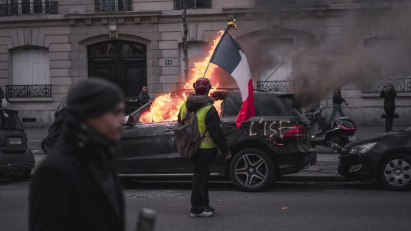 Thematic lead image: protest, street, fire, cars — Cost of Living Protests in France: Beyond the Street-Level Grievances | National Times