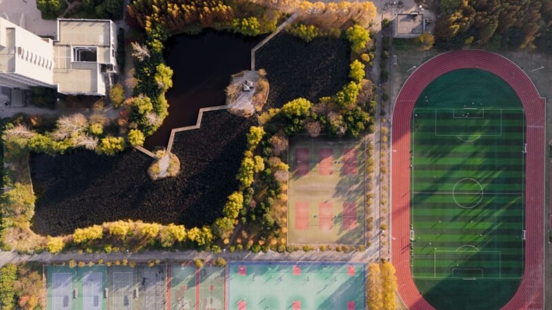Thematic lead image: tennis court — Tennis Upsets: Beyond the Court, What Do Early Exits Signal? | National Times