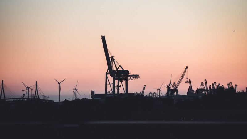 Thematic lead image: oil derricks, global economy — Oil Volatility Signals Deeper Economic Strain | National Times