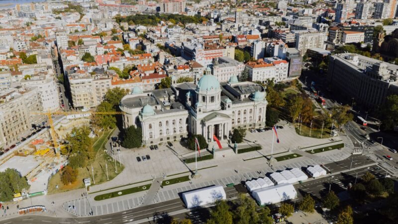 Thematic lead image: student protest, government building — Serbia's Post-Election Calculus: Defining Vucic's Enduring Influence | National Times