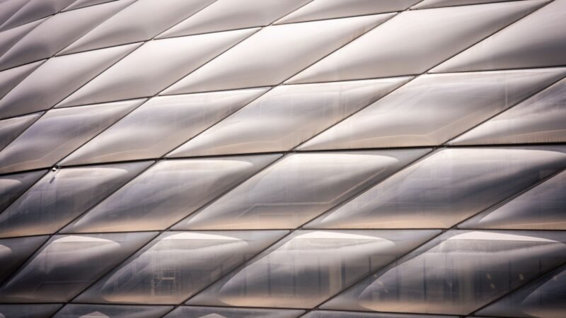 Thematic lead image: football stadium, global finance — Football's Geopolitical Future: Three Scenarios for 2030 | National Times