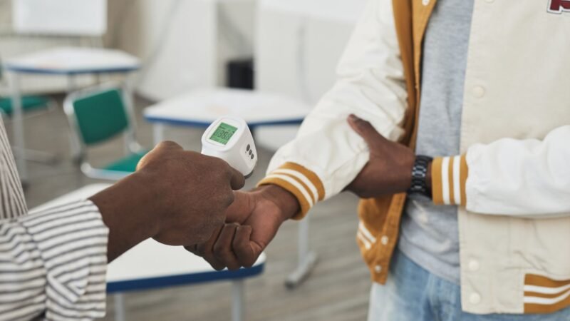 Thematic lead image: health screening airport — Ebola's Uncontained Arc: A Test of East Africa's Health Security | National Times